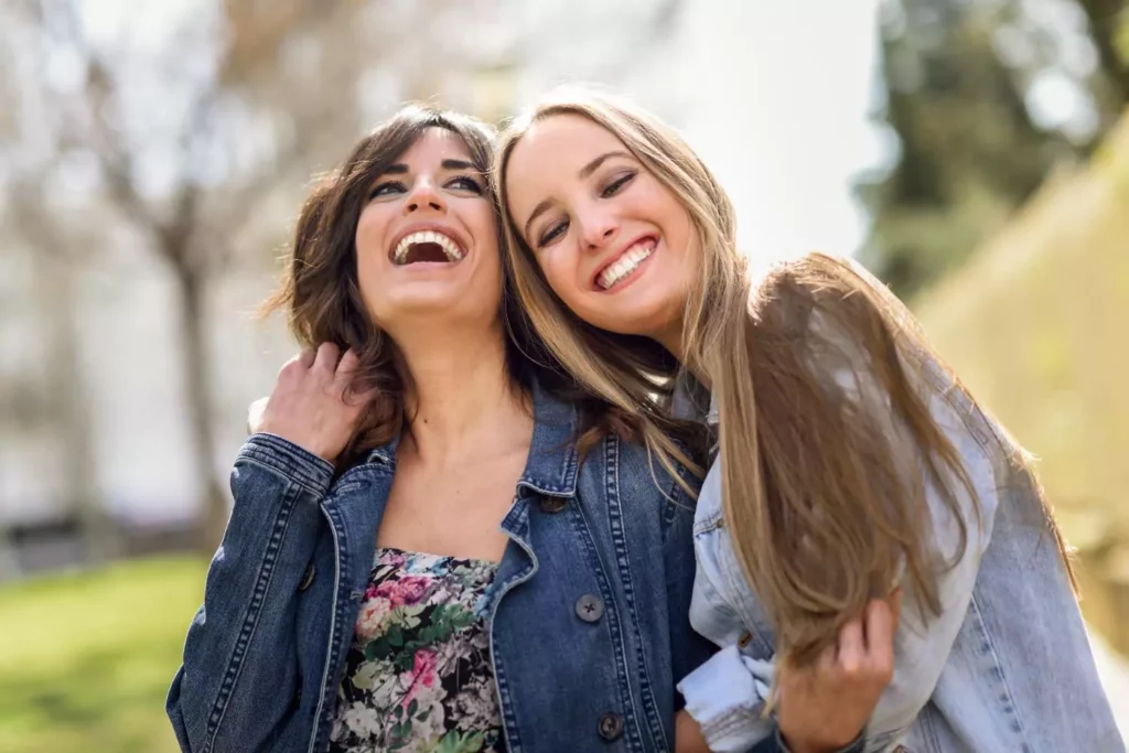 two female friends hugging
