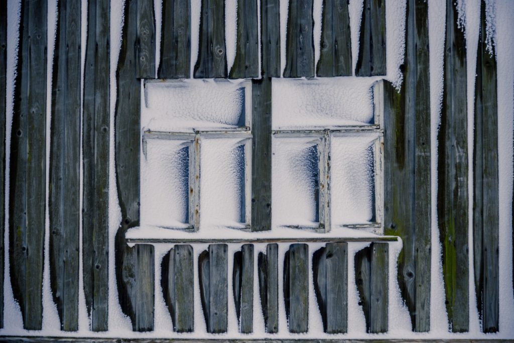 shack windows covered in snow