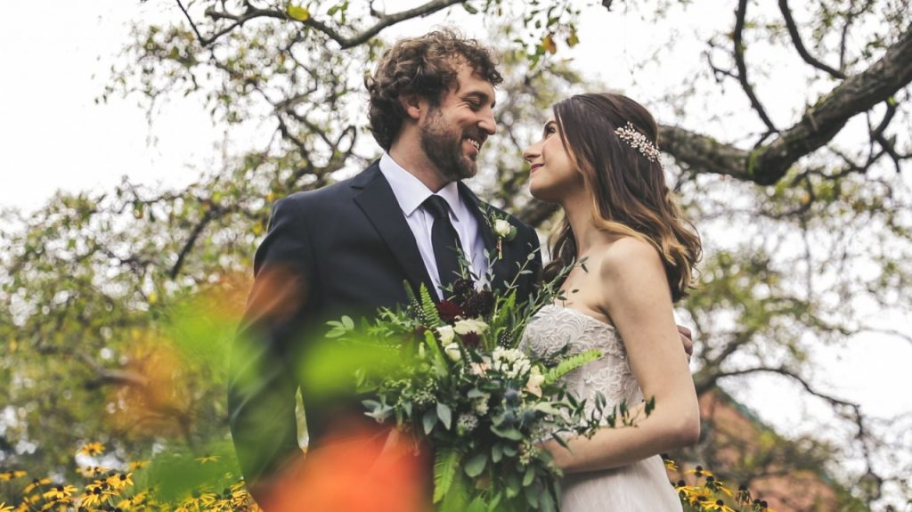 wedding couple smiling at each other
