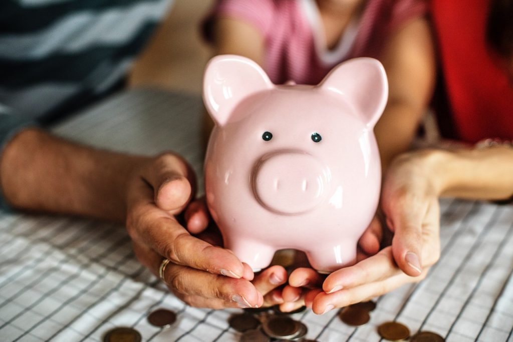 couple holding a piggy bank