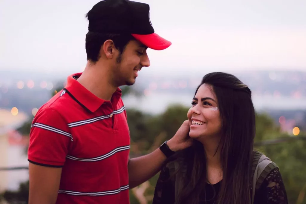 guy gently touching woman's face