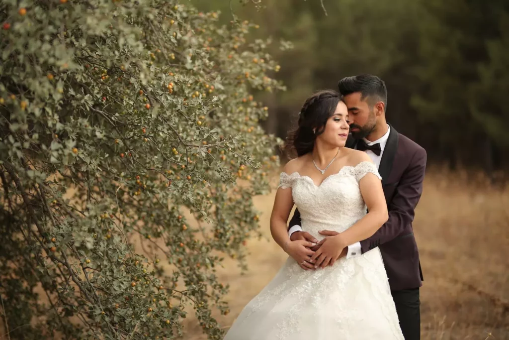 groom hugging his bride, they save their virginity for marriage