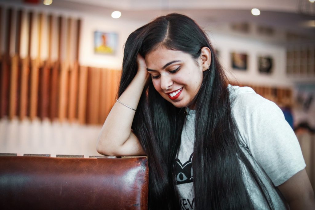 woman looking shy but smiling