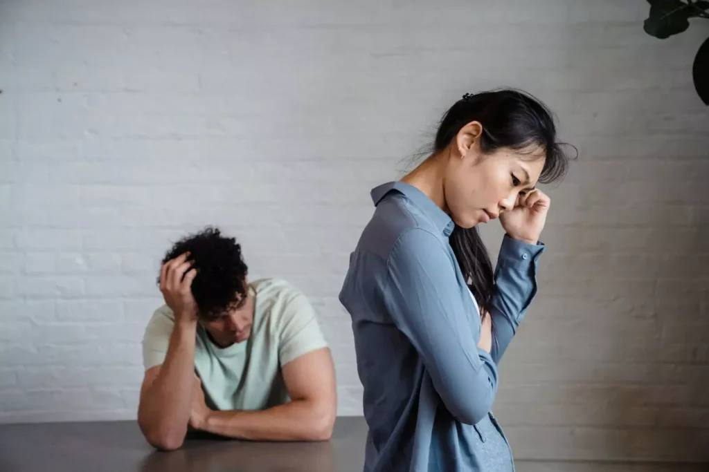 a frustrated man and woman discussing their engagement