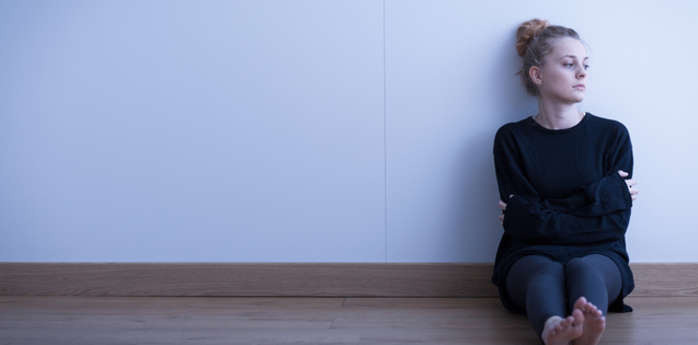 Sad young adult woman