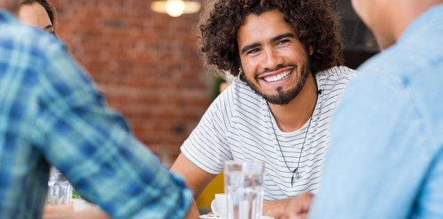 man sitting with friends
