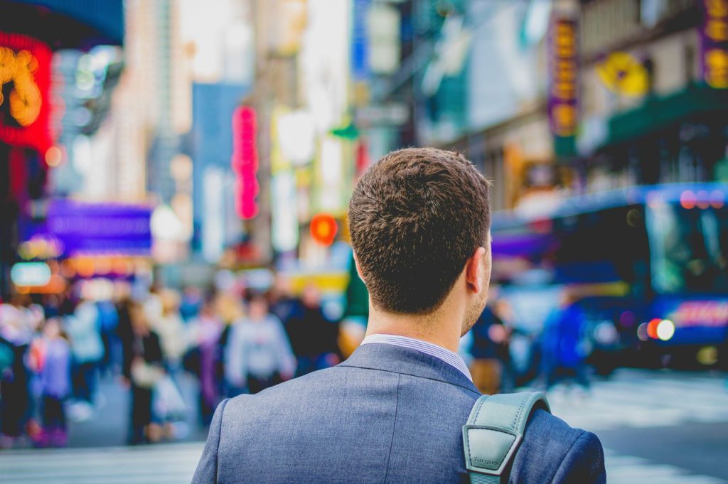 back of young professional in Times Square