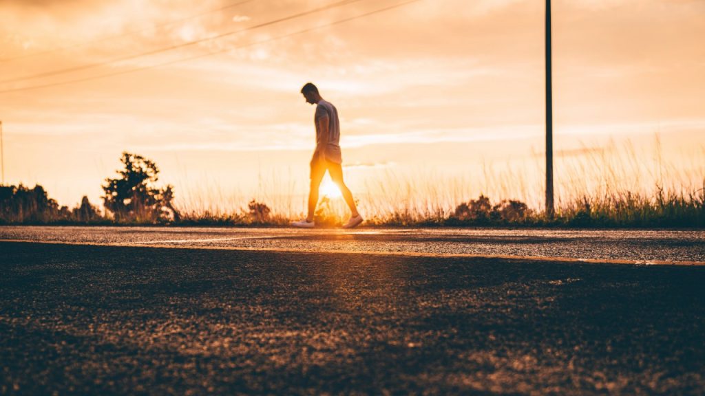 man walking on street