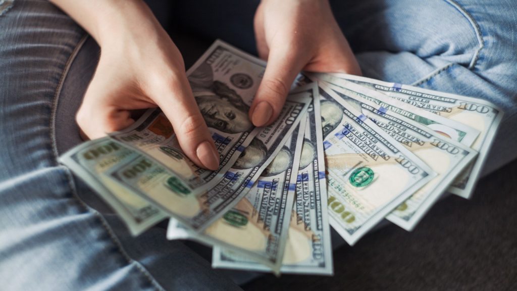 person hold cash