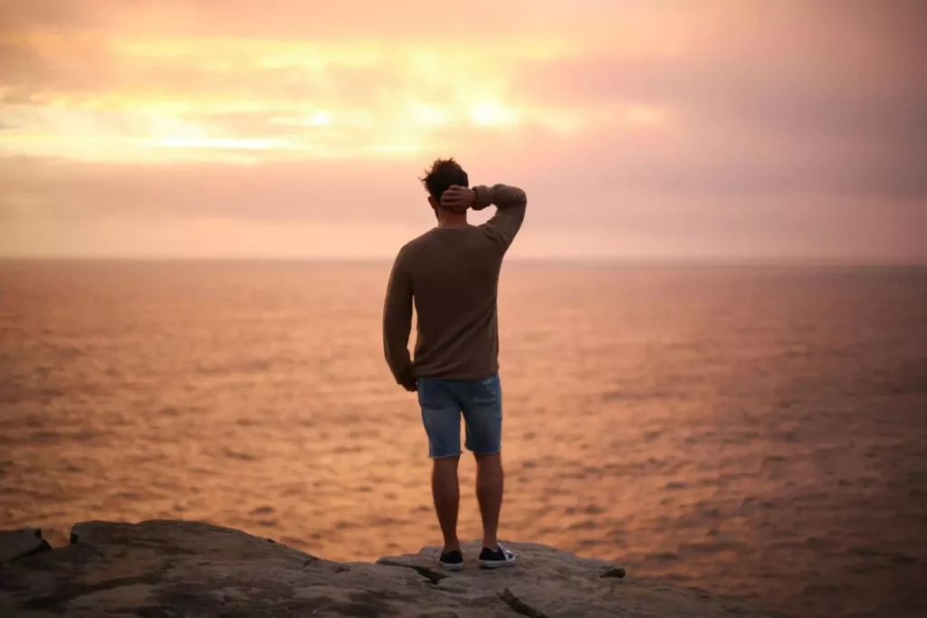 a man looking out over water, feeling like he is in a dry time with the Lord