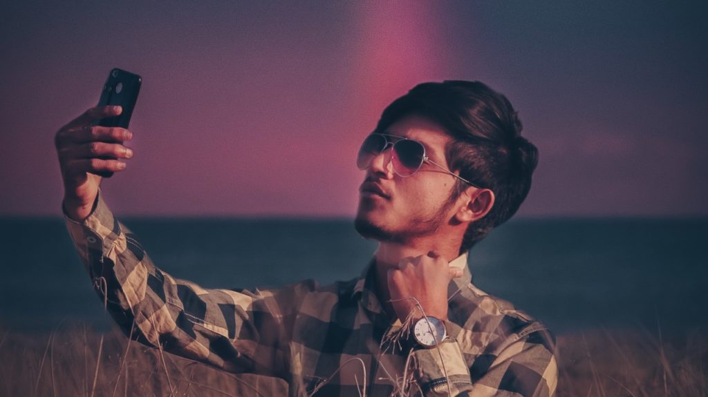 man taking selfie