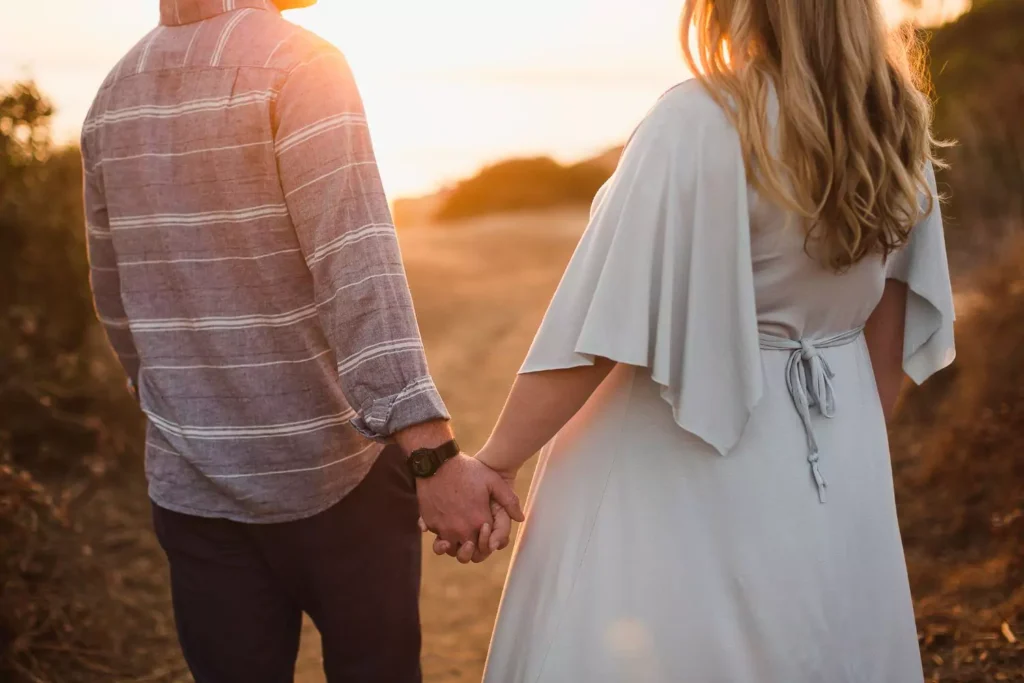 a couple holding hands, they have a positive view of sex