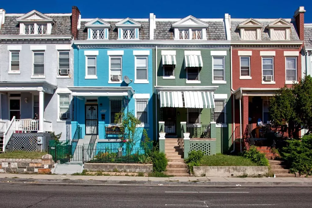 Townhomes of various colors lined up next to each other. Friendly neighborhood