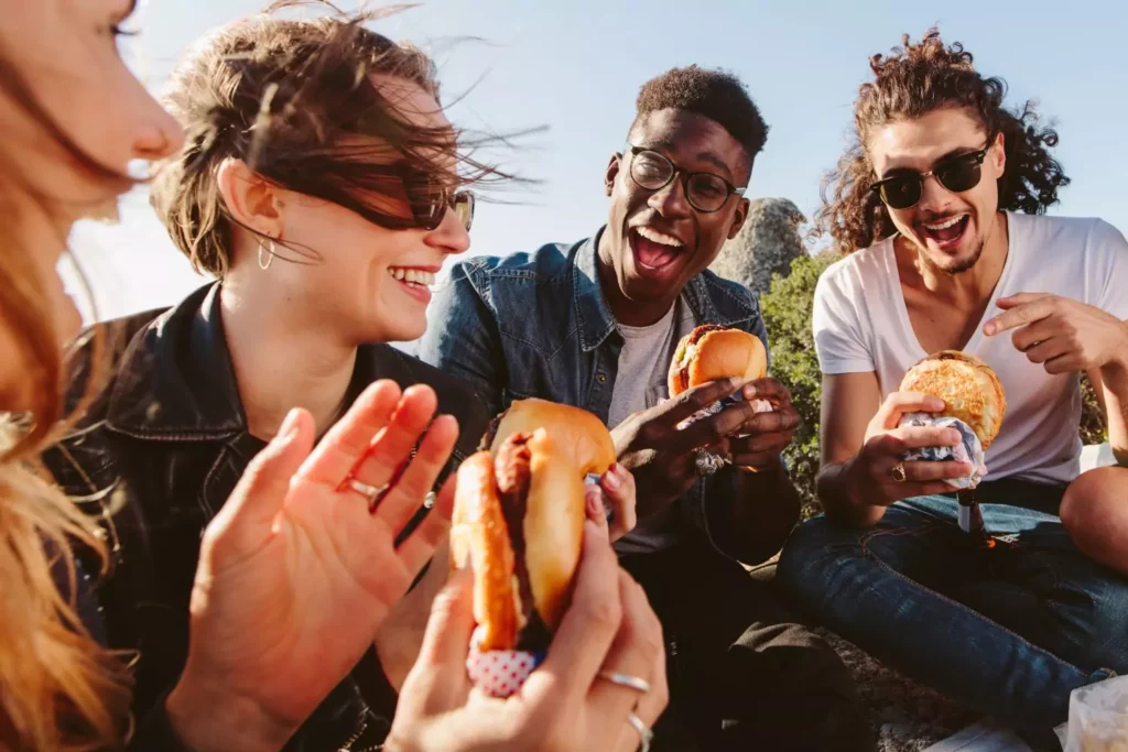 A group of friends sharing a meal together and laughing