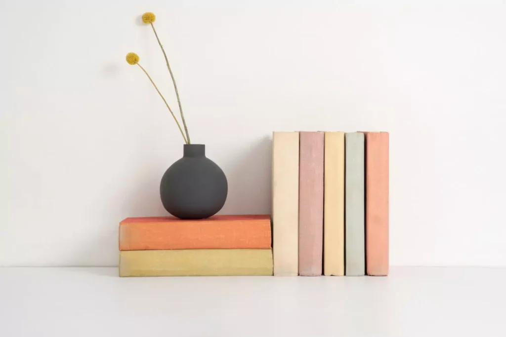 books stacked next to each other, your story is being written by God