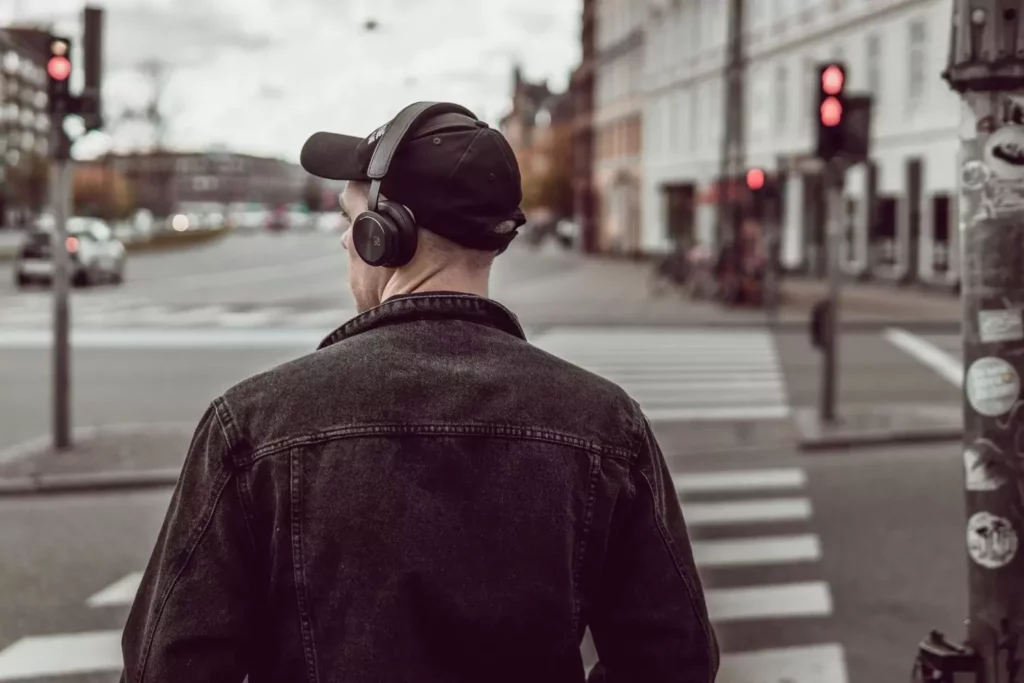 man wearing headphones, seeking attraction