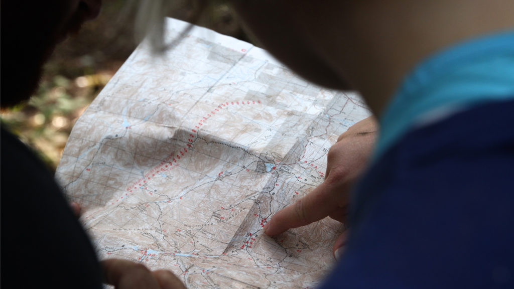 people looking at map